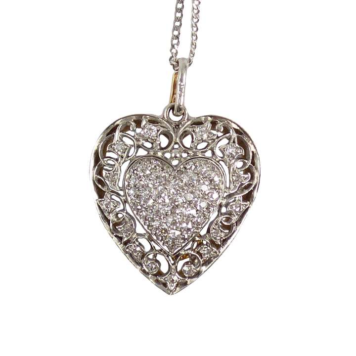 Diamond, platinum and gold heart locket pendant